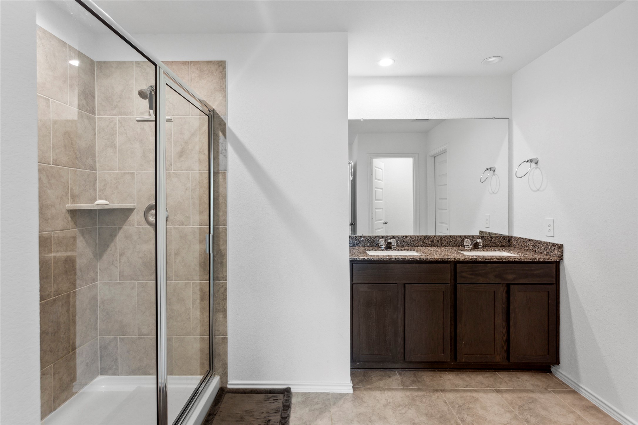 7510 Carson Court Rosharon, TX 77583 - Photo 10 of 23 a bathroom with a granite countertop sink shower and mirror