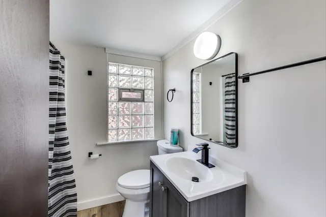 a bathroom with a glass door shower