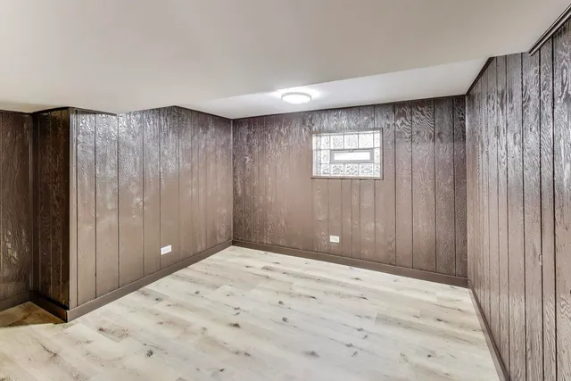 a bathroom with a mirror a toilet and shower