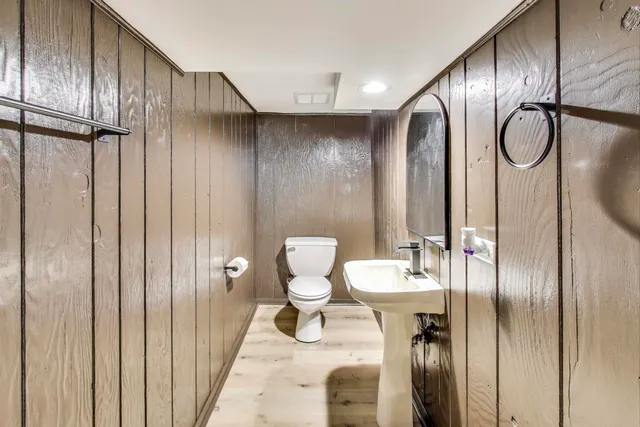 a kitchen with a refrigerator a sink and cabinets