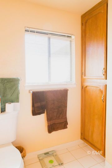 204 North Broadway Street Ridgecrest, CA 93555 - Photo 20 of 29 a bathroom with a sink and a mirror