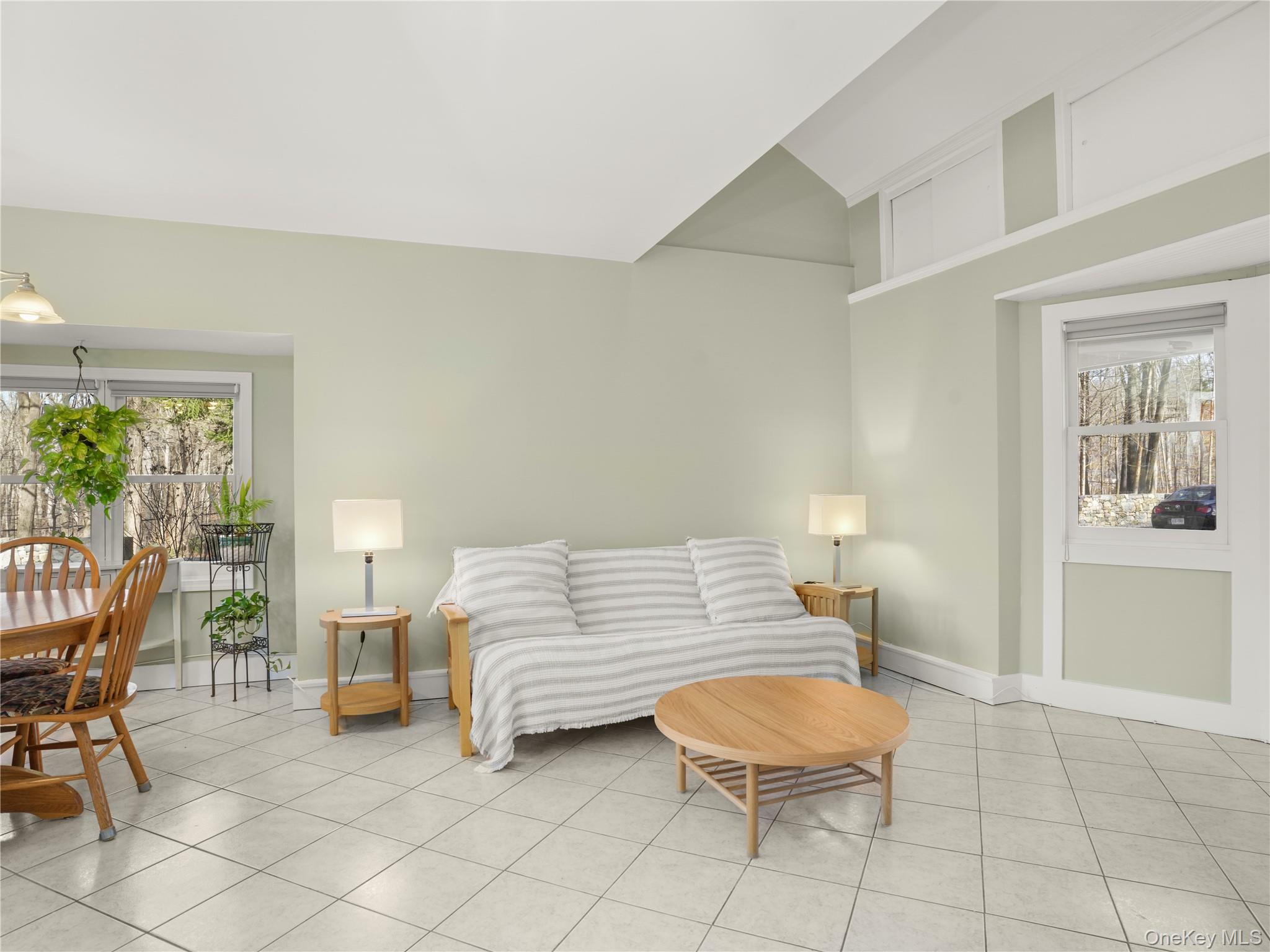 290 Salem Road Pound Ridge, NY 10576 - Photo 11 of 21 a living room with furniture a rug and a window