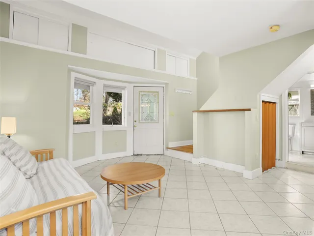 a living room with furniture and a table