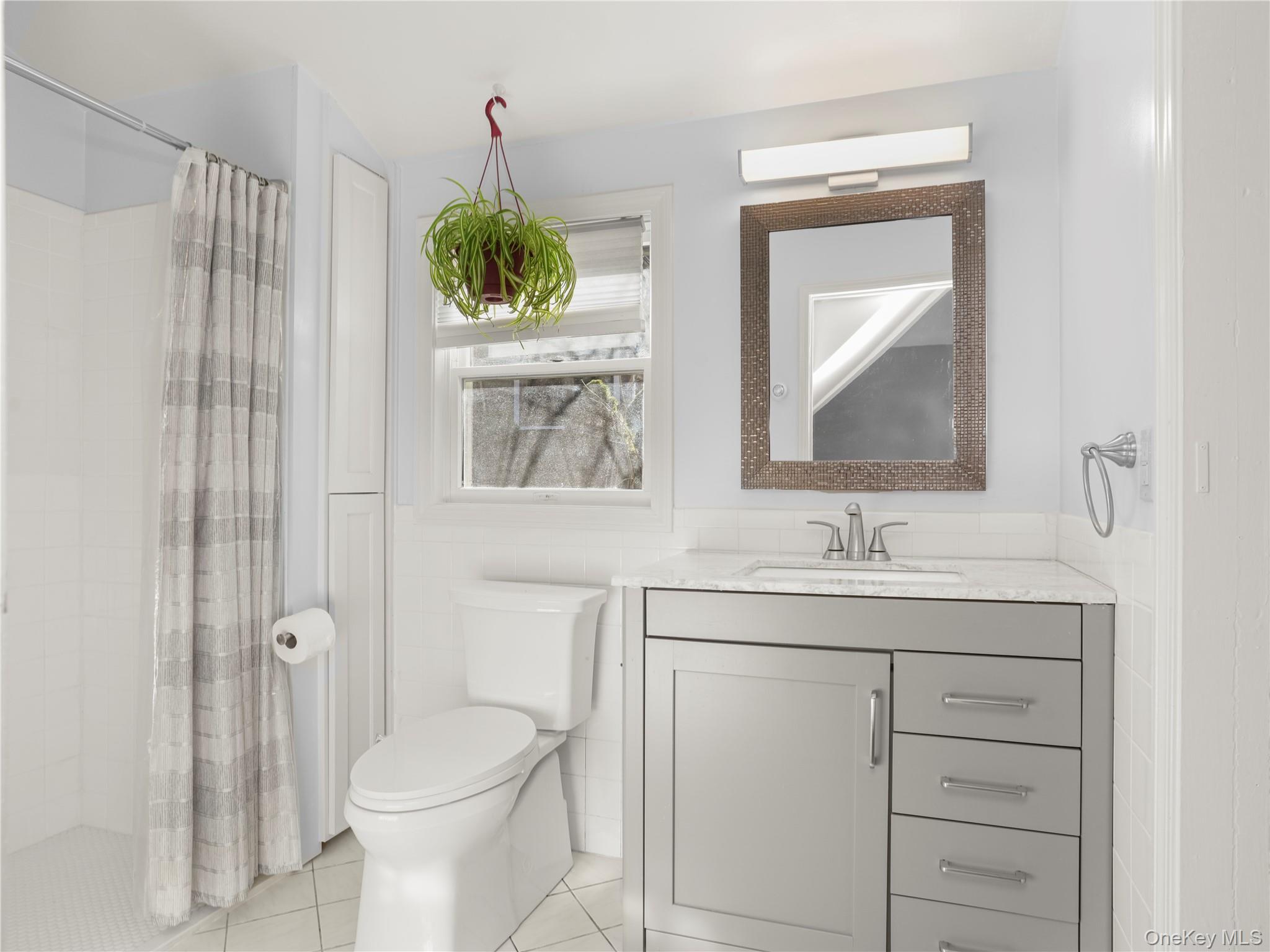 290 Salem Road Pound Ridge, NY 10576 - Photo 18 of 21 a bathroom with a toilet sink and mirror