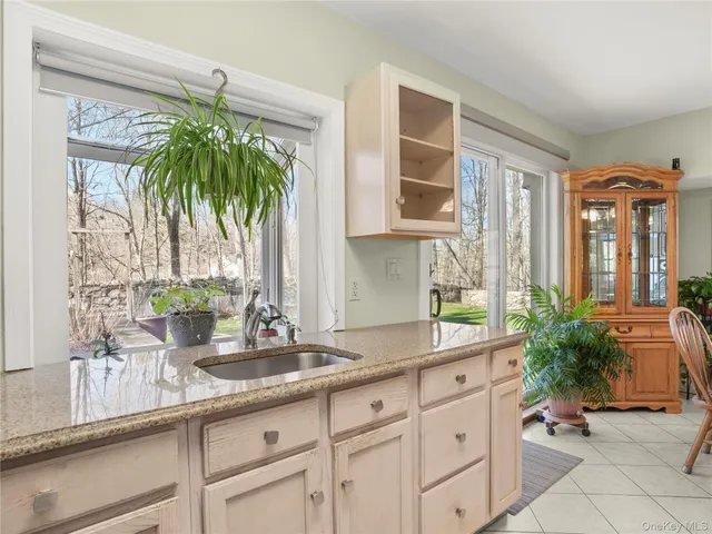 a kitchen with sink and window