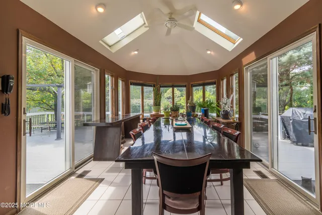 a dining room with furniture a window and kitchen view