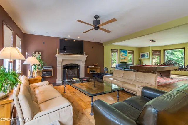 a open kitchen with stainless steel appliances granite countertop a stove and refrigerator
