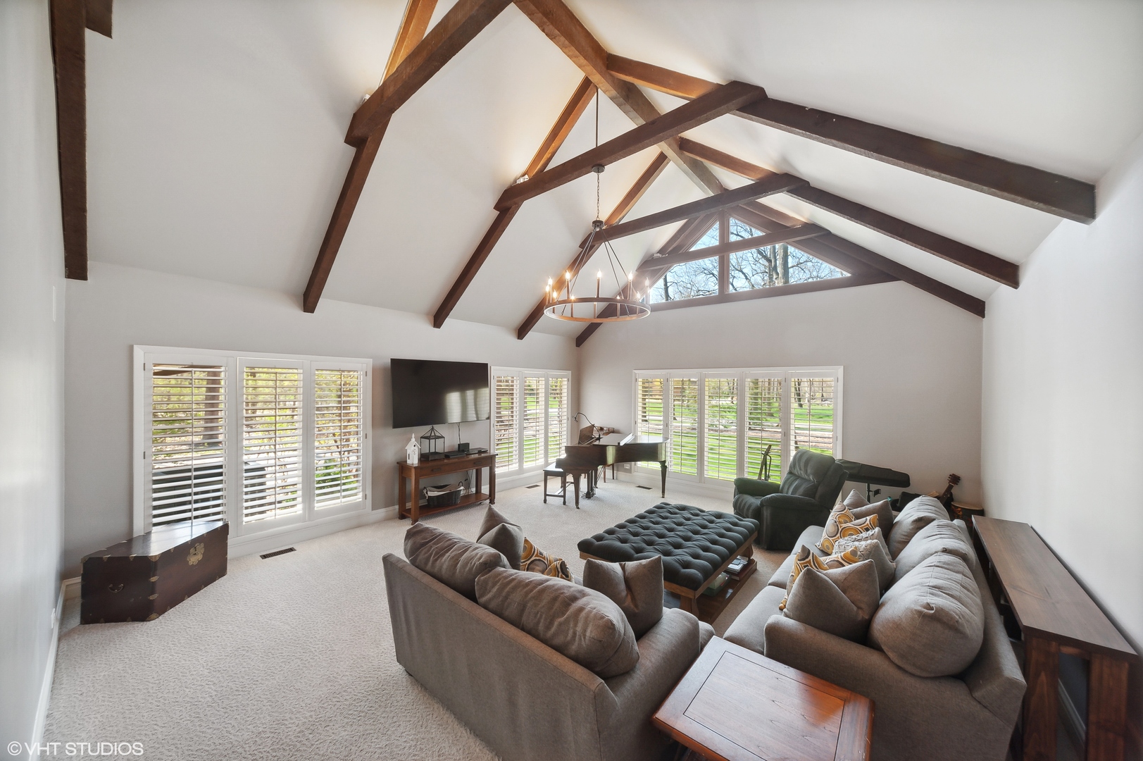 1685 Millburne Road Lake Forest, IL 60045 - Photo 10 of 21 a living room with furniture a fireplace and a flat screen tv
