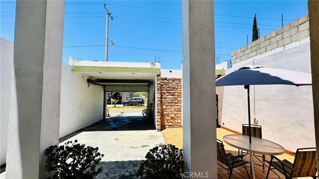 a kitchen view with table and chairs