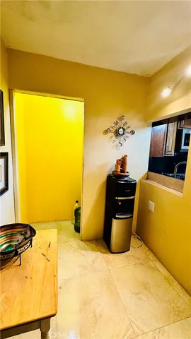 a bed sitting in a bedroom next to a blue wall