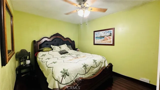 a bathroom with a granite countertop double vanity sink a mirror and a shower
