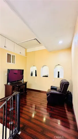 a view of a livingroom with furniture and wooden floor