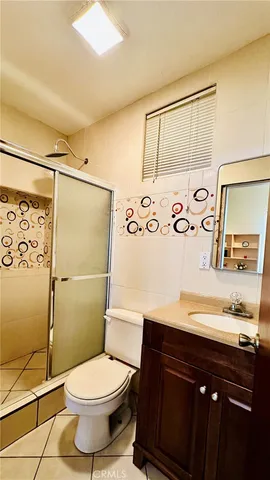 a bedroom with a bed and a view of bathroom