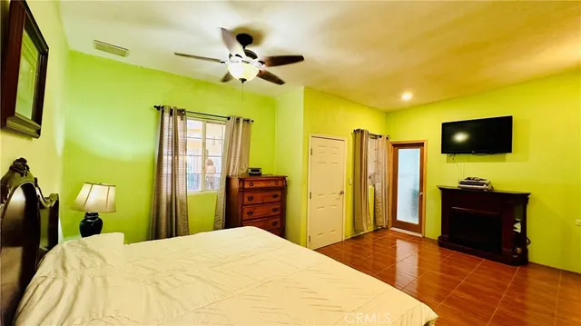 a living room with stainless steel appliances kitchen island granite countertop a sink and cabinets