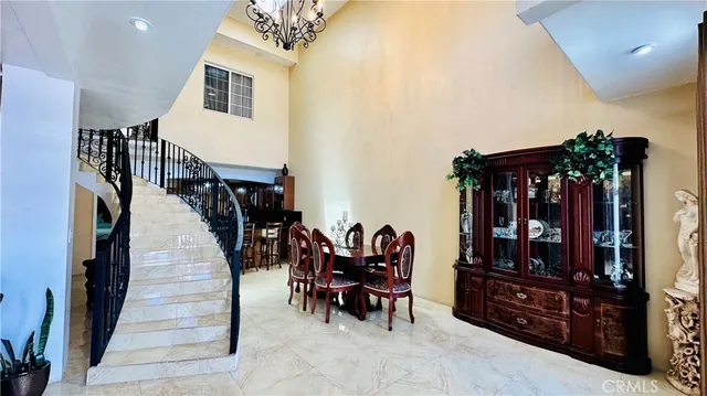 a view of a livingroom with furniture and a chandelier