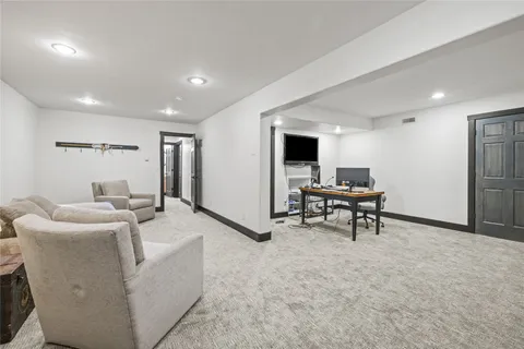 a living room with furniture and a rug