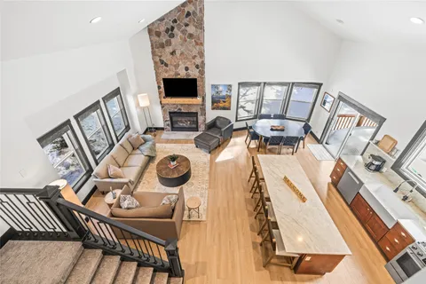 a view of a dining room with furniture wooden floor and chandelier