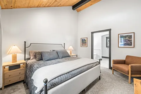 a bedroom with a bed and a couch