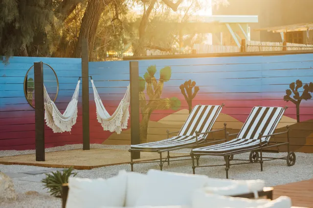 a backyard of a house with outdoor seating