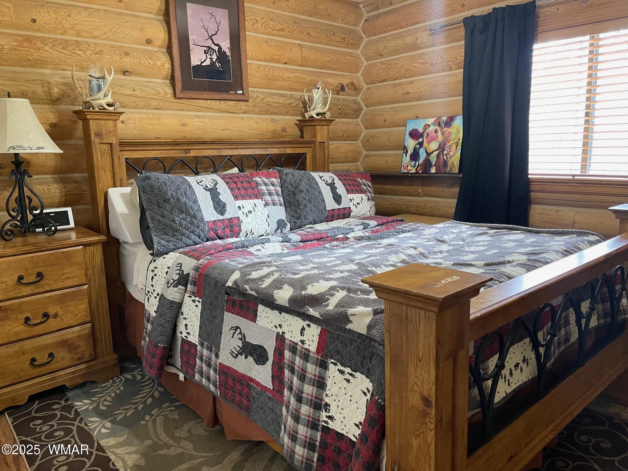 183 North Becker Lake Road Springerville, AZ 85938 - Photo 21 of 41 a bed room with a bed and a couch