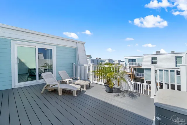 a living room with furniture a wooden floor and next to a window