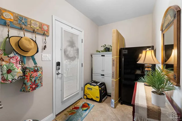 a living room with furniture and a bed