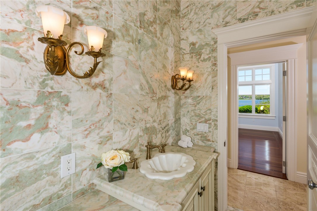 137 High Hill Road Tiverton, RI 02878 - Photo 20 of 39 The first floor also has a gorgeous, marble half bath.