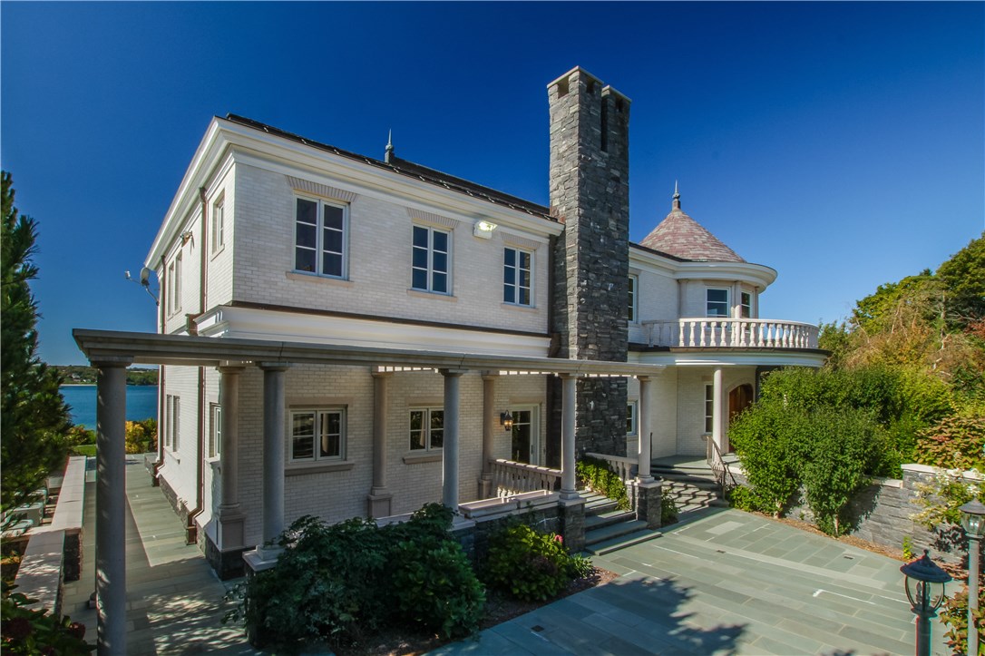 137 High Hill Road Tiverton, RI 02878 - Photo 2 of 39 Bluestone patios all around the property are tread-grade - extra thick and luxurious. This is the patio between the garage and boat storage building.