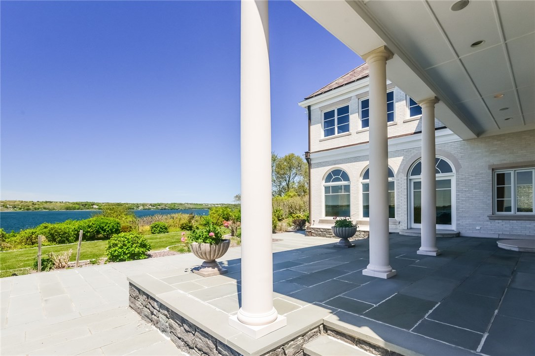 137 High Hill Road Tiverton, RI 02878 - Photo 4 of 39 Gorgeous, bluestone patio overlooking the water. Partially covered, the area directly off the dining room creates a perfect entertainment area.
