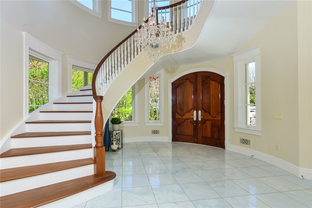 137 High Hill Road Tiverton, RI 02878 - Photo 6 of 39 The gorgeous, custom mahogany double doors and custom-made chandelier create a warm welcome.