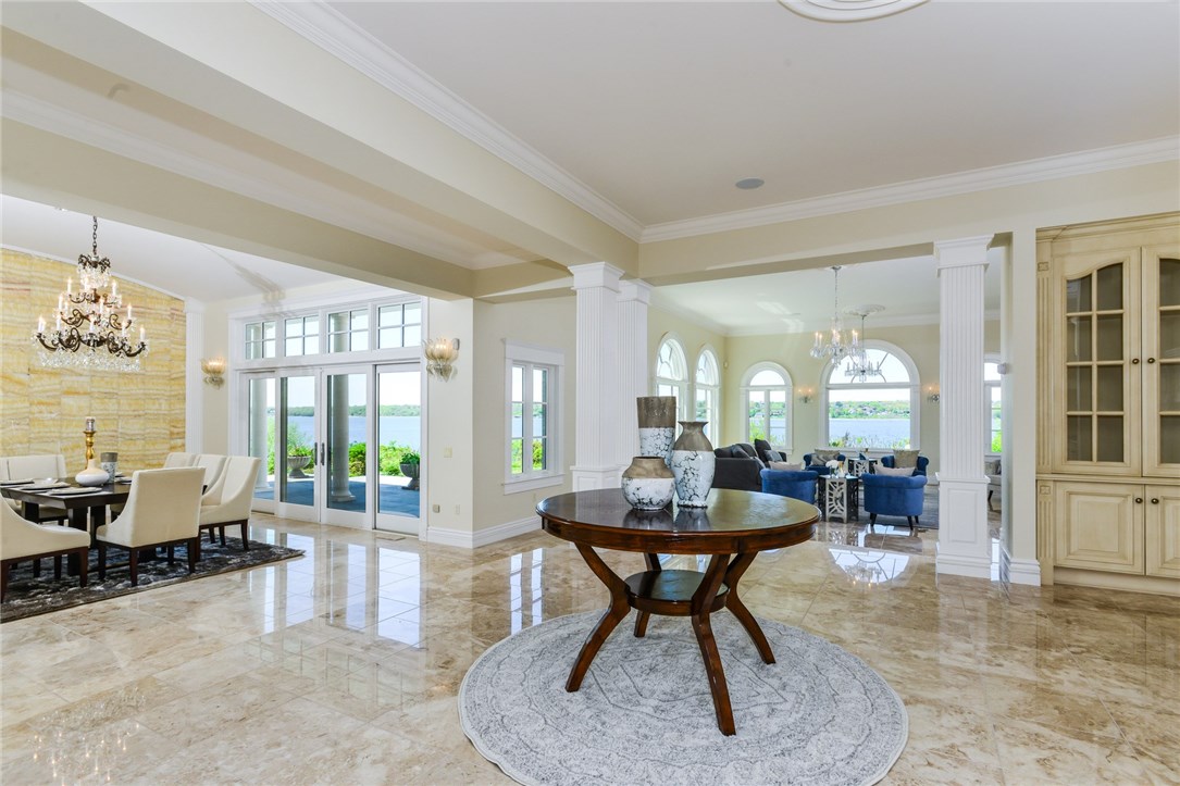 137 High Hill Road Tiverton, RI 02878 - Photo 10 of 39 A den area with custom cabinetry and wiring for television is located adjacent to the living and dining rooms.