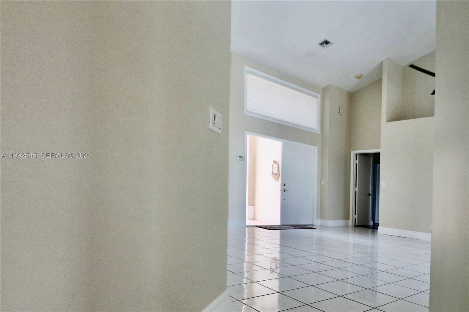 2686 Palmer Place Weston, FL 33332 - Photo 27 of 42 From the formal to the family area.
