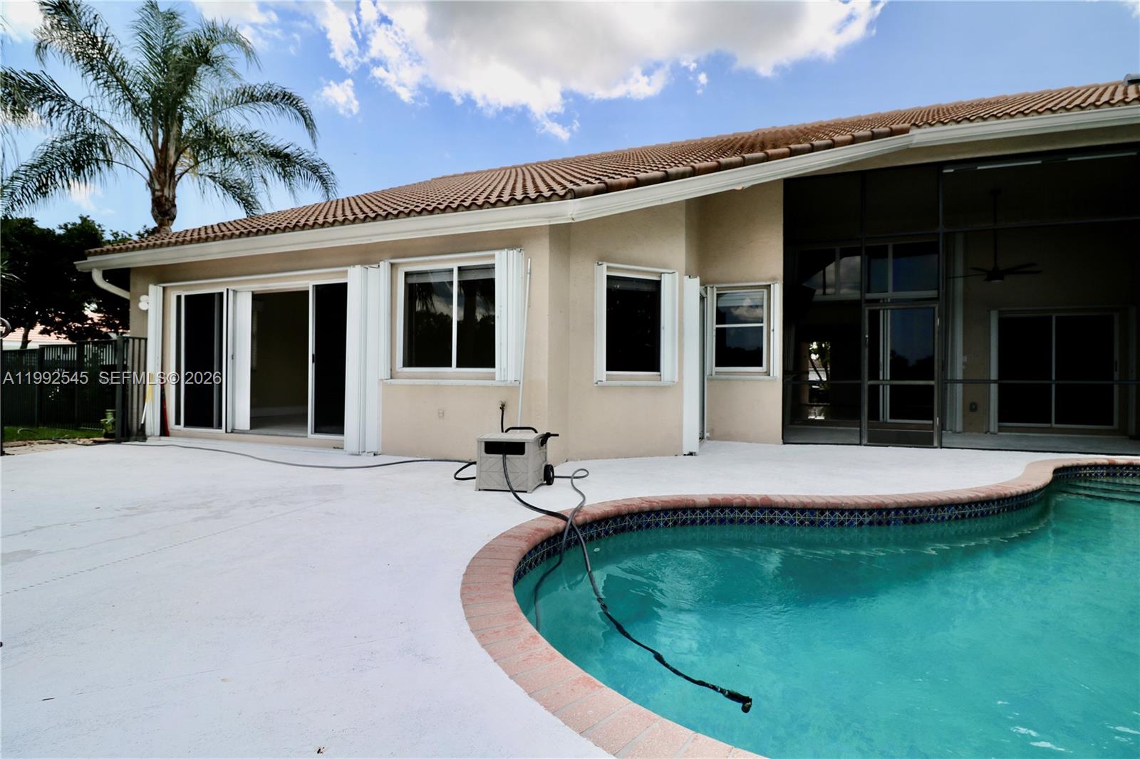 2686 Palmer Place Weston, FL 33332 - Photo 8 of 42 House back view, screened porch, pool