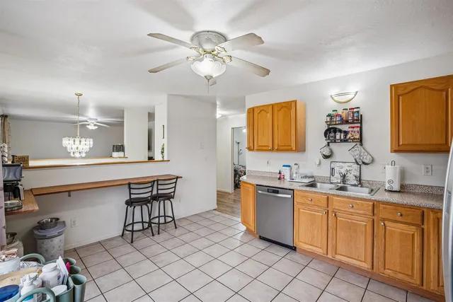 a kitchen with sink cabinets and window