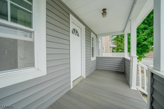 a view of a porch and hardwood floor