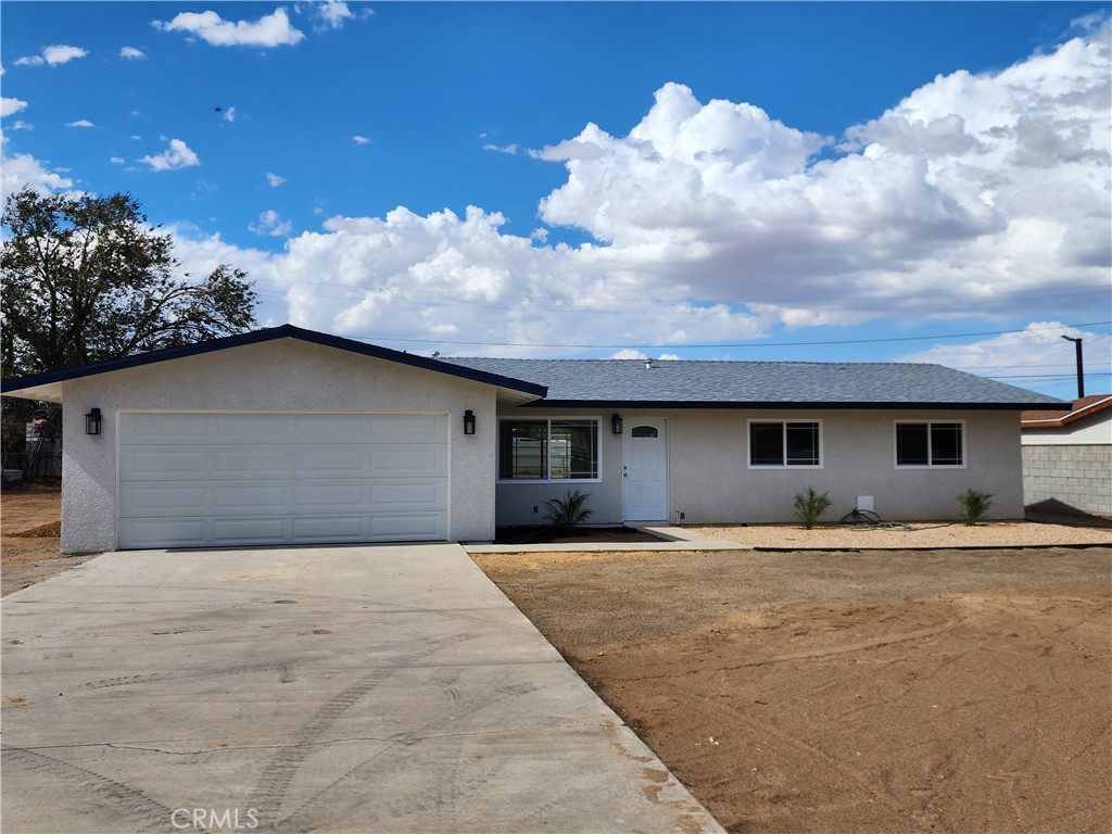 13250 El Rio Road Victorville, CA 92392 - Photo 1 of 1 a house with trees in the background