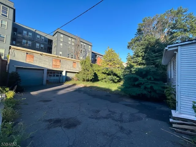 a pathway of a house with a yard