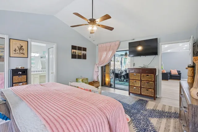 a bathroom with a granite countertop sink a toilet and a mirror