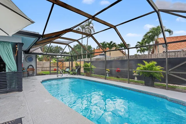 a view of a swimming pool with a patio