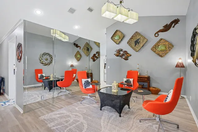 a living room with furniture a rug and a table