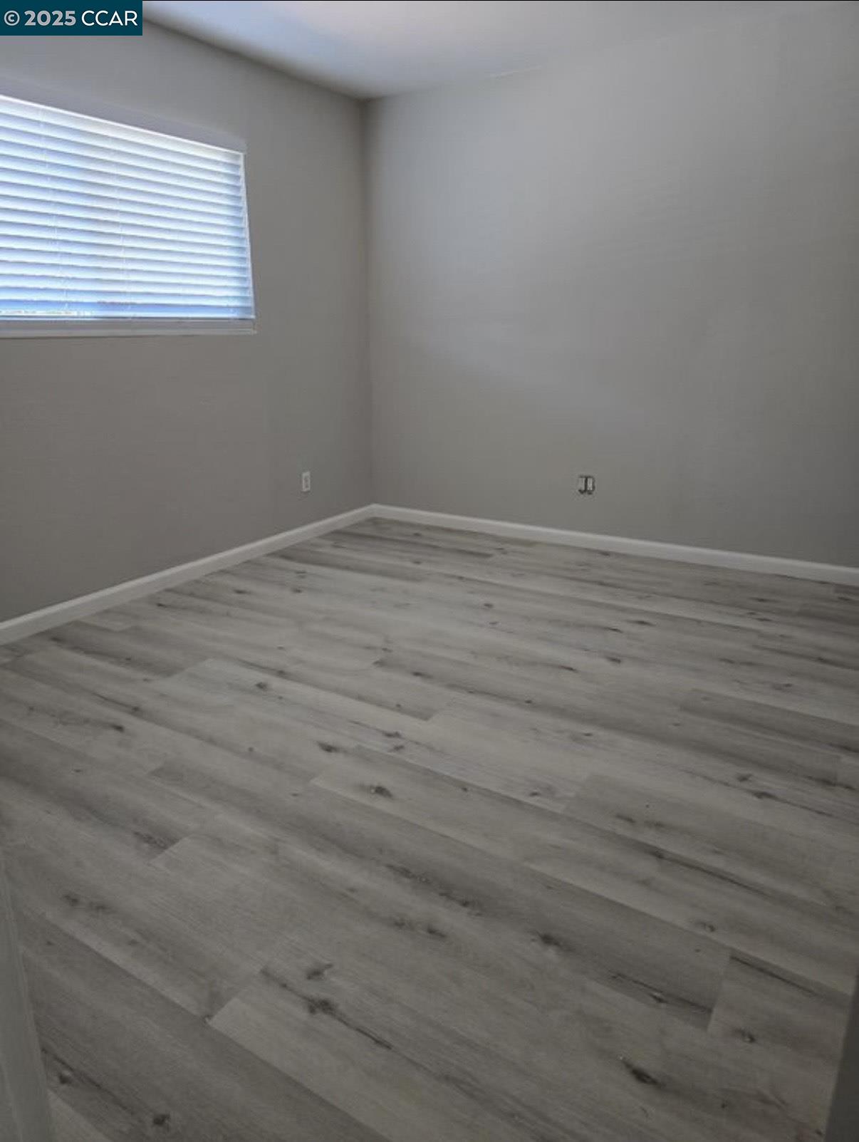 4340 Balfour Road Brentwood, CA 94513 - Photo 12 of 21 a view of a room that has wooden floor and window