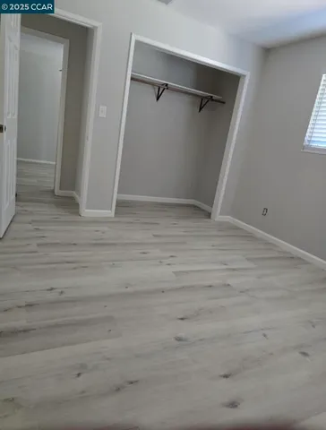 a view of an empty walk in closet