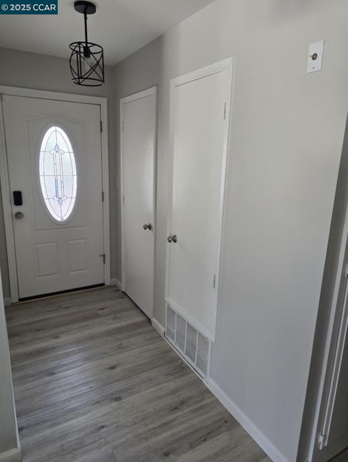 4340 Balfour Road Brentwood, CA 94513 - Photo 4 of 21 a view of a hallway with wooden floor