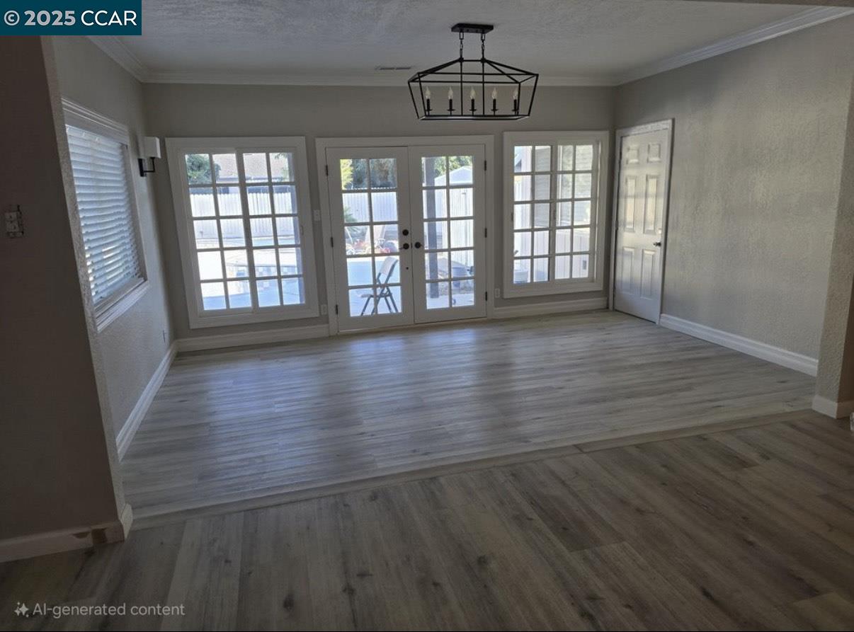 4340 Balfour Road Brentwood, CA 94513 - Photo 5 of 21 a view of an empty room with wooden floor and a window