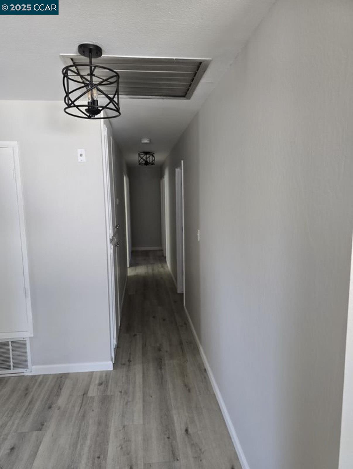 4340 Balfour Road Brentwood, CA 94513 - Photo 6 of 21 a view of a hallway with wooden floor