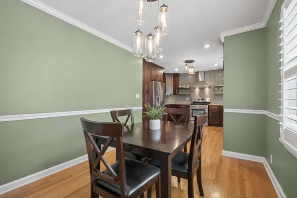 a kitchen with stainless steel appliances granite countertop a refrigerator a sink dishwasher a stove and a microwave oven with cabinets