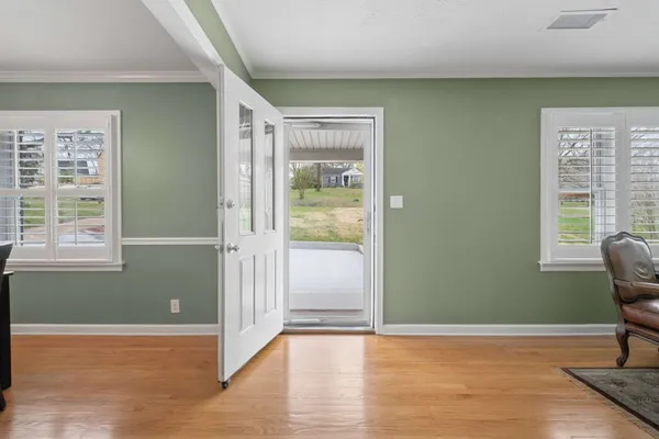 a kitchen with kitchen island granite countertop stainless steel appliances cabinets a sink and a counter top space