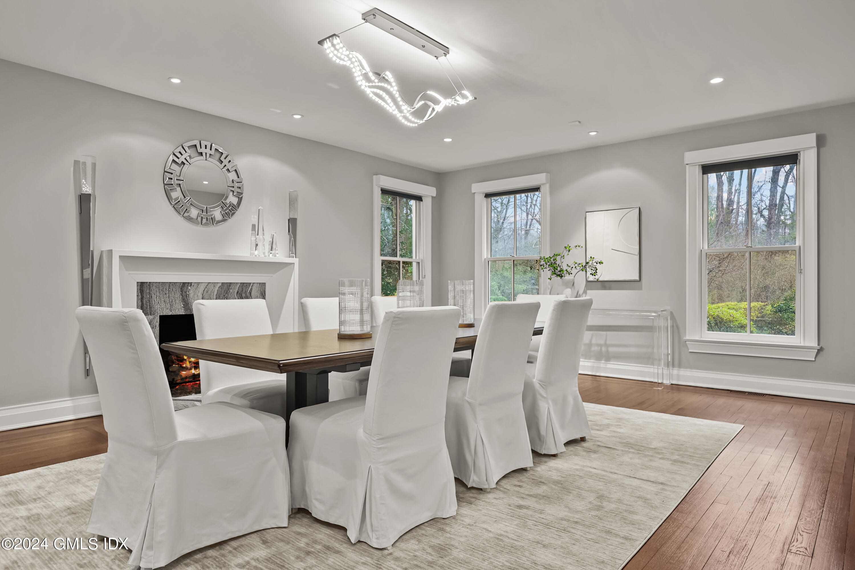 24 Highland Farm Road Greenwich, CT 06831 - Photo 11 of 34 a view of a dining room with furniture window and wooden floor