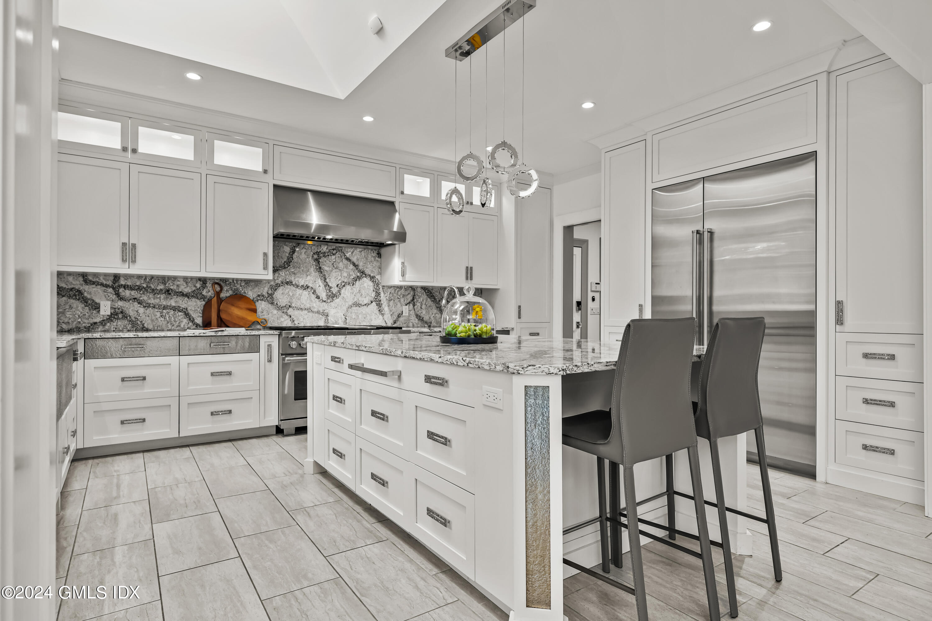 24 Highland Farm Road Greenwich, CT 06831 - Photo 13 of 34 a kitchen with cabinets appliances and a dining table