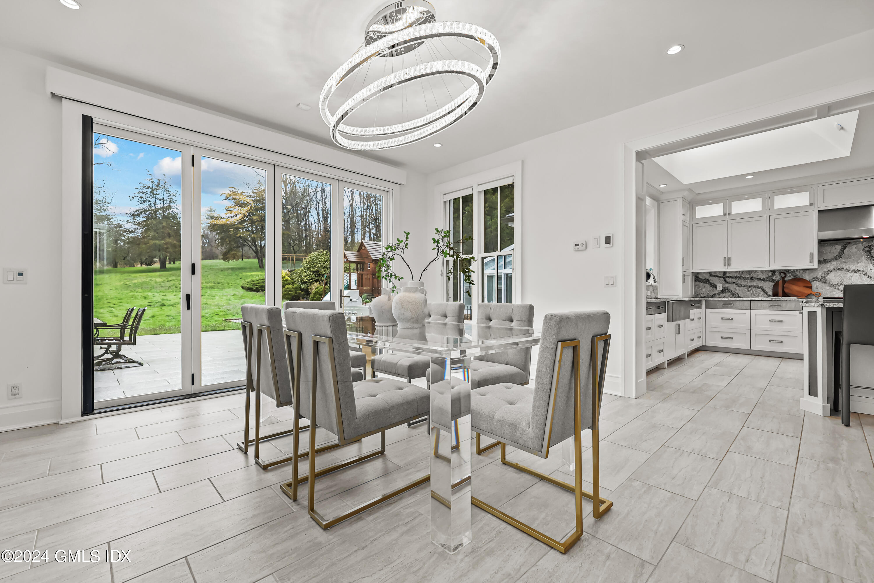 24 Highland Farm Road Greenwich, CT 06831 - Photo 14 of 34 a view of a dining room with furniture window and outside view